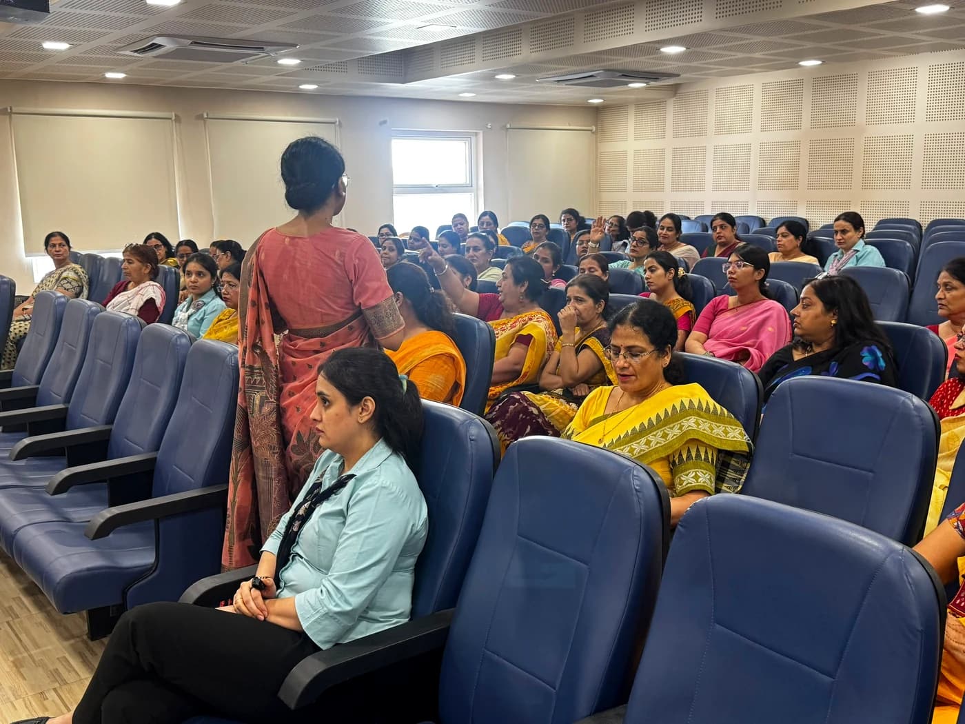 Teachers attending the Life Skills workshop, seated in the auditorium